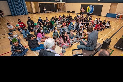 ETHAN CAIRNS / WINNIPEG FREE PRESS
Students of A. E. Wright School to rehearse a cree musical with Elder Winston who is beating a drum, and music teacher Jordan Laidlaw playing guitar in the gymnasium midday in Winnipeg, Manitoba on Monday June 6, 2022. 