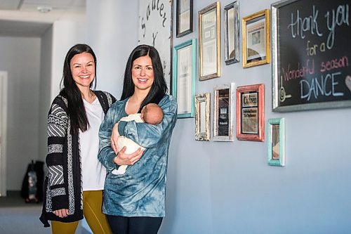 MIKAELA MACKENZIE / WINNIPEG FREE PRESS

Danielle Auld (left) and Melanie Ducharme (with baby Gus Jaotter), co-owners of Prairie Soul Dance Company, pose for a portrait in their studio in Niverville on Monday, June 6, 2022.  For Gabby story.
Winnipeg Free Press 2022.