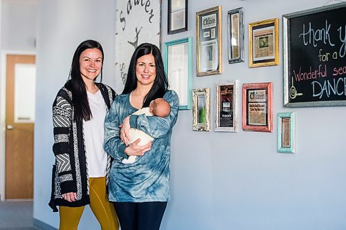 MIKAELA MACKENZIE / WINNIPEG FREE PRESS

Danielle Auld (left) and Melanie Ducharme (with baby Gus Jaotter), co-owners of Prairie Soul Dance Company, pose for a portrait in their studio in Niverville on Monday, June 6, 2022.  For Gabby story.
Winnipeg Free Press 2022.