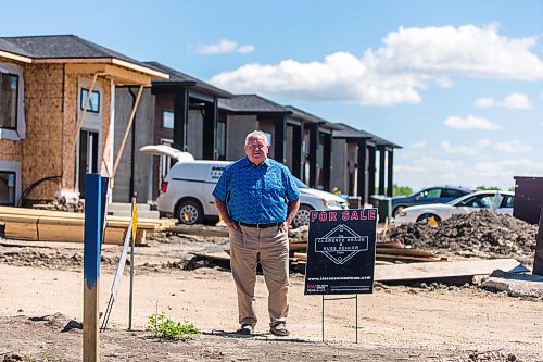 MIKAELA MACKENZIE / WINNIPEG FREE PRESS

Clarence Braun, realtor with Keller Williams Real Estate Services, poses for a portrait in a new development he's sold in Niverville on Monday, June 6, 2022.  For Gabby story.
Winnipeg Free Press 2022.