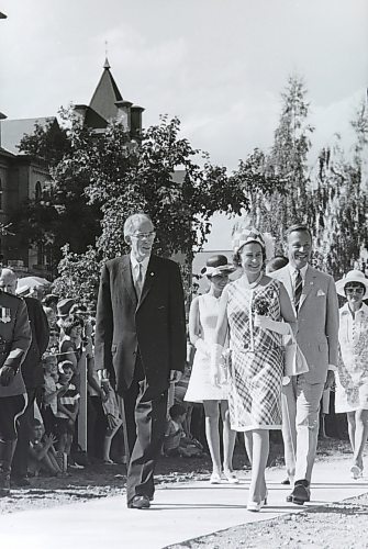 Queen Elizabeth II smiles as she strolls on campus at Brandon University where she laid the cornerstone of the John R. Brodie Science Centre during her visit to Brandon in July, 1970. At left is then-university chancellor Stanley Knowles and at right is then federal supply minister James Richardson. Princess Anne is immediately behind her mother. (Brandon Sun Files)