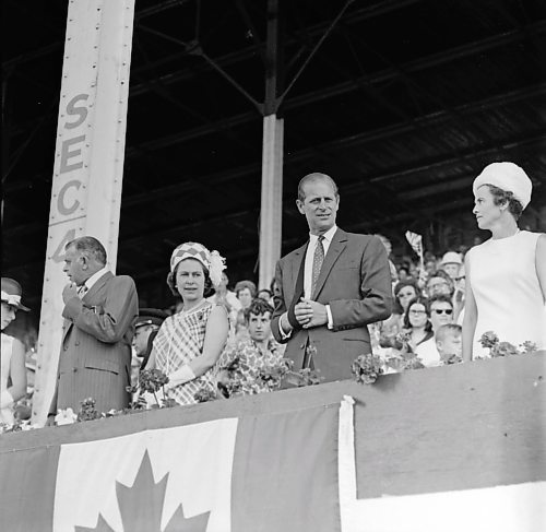 Queen Elizabeth II and Prince Philip take in the action in the Provincial Exhibition of Manitoba grandstand during a royal visit to Brandon in July, 1970. (Brandon Sun Files)