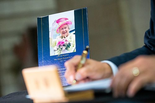 Daniel Crump / Winnipeg Free Press. Mayor Brian Bowman signs the book of condolences commemorating Queen Elizabeth II at the Manitoba legislature in Winnipeg. September 8, 2022.