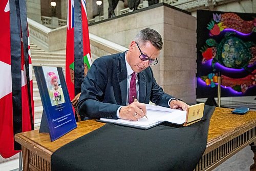 Daniel Crump / Winnipeg Free Press. Mayor Brian Bowman signs the book of condolences commemorating Queen Elizabeth II at the Manitoba legislature in Winnipeg. September 8, 2022.