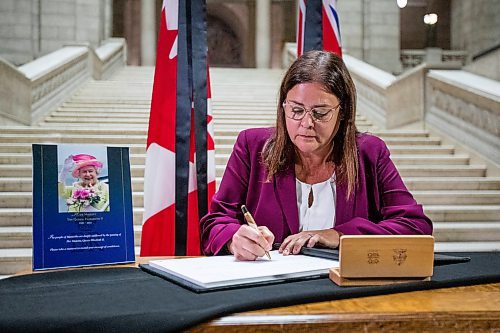 Daniel Crump / Winnipeg Free Press. Premier Heather Stefanson signs the book of condolences commemorating Queen Elizabeth II at the Manitoba legislature in Winnipeg. September 8, 2022.