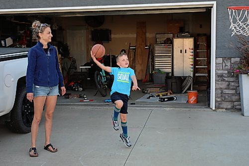 09092022
Six-year-old Spencer Silvius takes a shot on net while playing basketball with his mom Lisa in the driveway of their home in Brandon on Friday.  (Tim Smith/The Brandon Sun)
