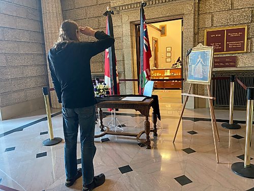 MALAK ABAS / WINNIPEG FREE PRESS

Dawn White and her son Jason Ostapyk were moved to tears at the book of condolences for the Queen at the Legislative Building Monday morning. The photos are of two instances when Jason saw the Queen in person, he gave her flowers each time. 

September 12, 2022
