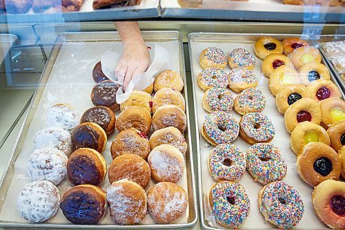 MIKE DEAL / WINNIPEG FREE PRESS
Russ Meier, owner of the Donut House, 500 Selkirk Avenue, which has been around in one form or another - OK, mostly round - for 75 years, this year.
Doughnuts are their bread and butter, but they also turn out German-style breads, pies and cookies, which they distribute to various grocery chains, thru-out the city. People come far and wide for their jambusters, too, a Winnipeg delicacy. 
220913 - Tuesday, September 13, 2022.