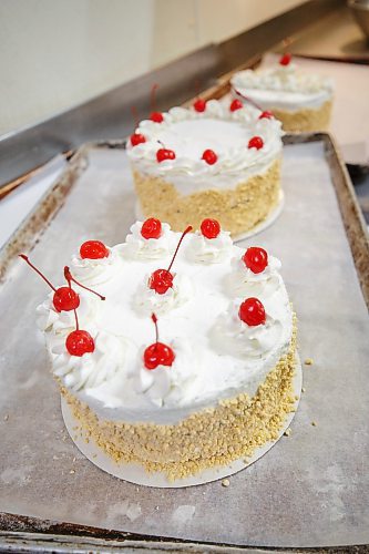 MIKE DEAL / WINNIPEG FREE PRESS
Cherries on top of the freshly iced cakes.
Russ Meier, owner of the Donut House, 500 Selkirk Avenue, which has been around in one form or another - OK, mostly round - for 75 years, this year.
220913 - Tuesday, September 13, 2022.