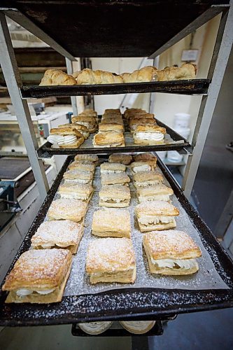 MIKE DEAL / WINNIPEG FREE PRESS
Creme filled delicacy's wait to be boxed up. 
Russ Meier, owner of the Donut House, 500 Selkirk Avenue, which has been around in one form or another - OK, mostly round - for 75 years, this year.
220913 - Tuesday, September 13, 2022.