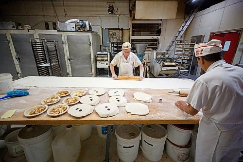MIKE DEAL / WINNIPEG FREE PRESS
Baker, Peter Souter, rolls out a very long sheet of dough in preparation for making some apple strudels, while Bakery Foreman, Thuan Nguyen, puts the pie crust tops on some pies.
Russ Meier, owner of the Donut House, 500 Selkirk Avenue, which has been around in one form or another - OK, mostly round - for 75 years, this year.
220913 - Tuesday, September 13, 2022.