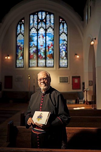 13092022
The Very Reverend William G. Cliff, VII Bishop of Brandon, holds a book of condolence for Her Majesty Queen Elizabeth II at St. Matthew's Anglican Cathedral in Brandon on Tuesday. 
(Tim Smith/The Brandon Sun)