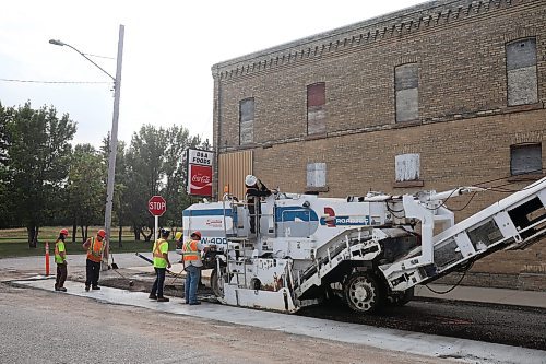 13092022
Workers with Zenith Paving do milling work in advance of repaving along Broadway Street in Glenboro on Tuesday. 
(Tim Smith/The Brandon Sun)