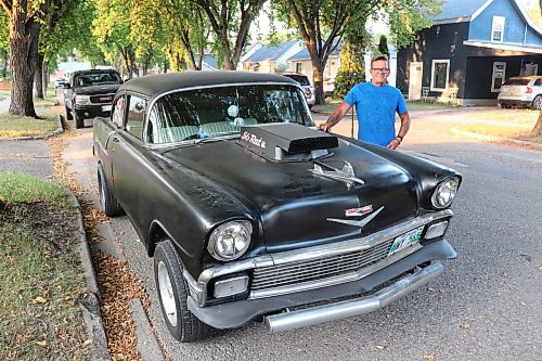 Autoglass Express owner Dave DeMarce poses for a photo next to his 1956 Chevrolet Bel Air two-door on Wednesday evening in Brandon. (Kyle Darbyson/The Brandon Sun) 