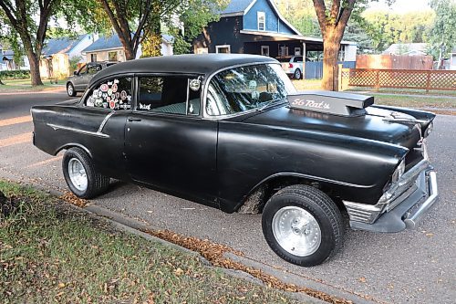 A side view of Dave DeMarce's 1956 Chevrolet Bel Air, which features heavily modified elements such as a prominent hood scoop and raised suspension. (Kyle Darbyson/The Brandon Sun) 