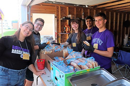 Members of Vincent Massey High School's student council prepare for a barbecue on Wednesday to welcome Grade 9 students to their new school. These students are, from left to right, Lucy MacPherson-Blair, Luke MacPherson-Blair, Danika Robb, Martin Riquelme and Andrew Badea. (Kyle Darbyson/The Brandon Sun)