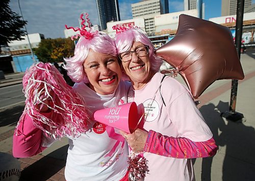 JOHN WOODS / WINNIPEG FREE PRESS
Marnie Bodner, left, and her mother Mary-Ellen, a cancer survivor and Chemo Savvy dragon boat team member, celebrate after crossing the finish line at the Canadian Cancer Society Run For The Cure Sunday, October 02, 2022. 

Re: ?