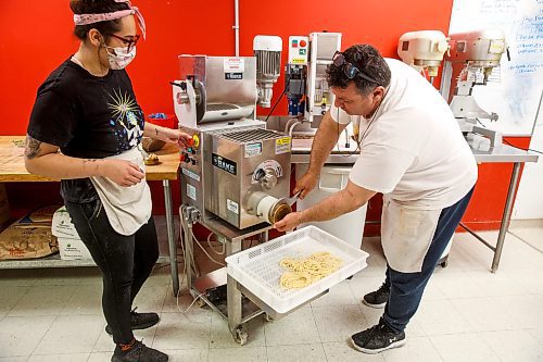 MIKE DEAL / WINNIPEG FREE PRESS

Alfonso Maury switches the head of the pasta making machine so that it can make a different pasta while Kitchen Manager, Alicia Robinson (left), helps out.

Alfonso Maury, owner of La Pampa and Corrientes Argentine Pizzeria, has started a new fresh pasta venture called Tuco. He's making fresh, handmade Argentinian pastas and pre-made pasta dishes for sale to the public through La Pampa (his grocery market) at 1604 St. Mary's Road.

See Eva Wasney story

211028 - Thursday, October 28, 2021.