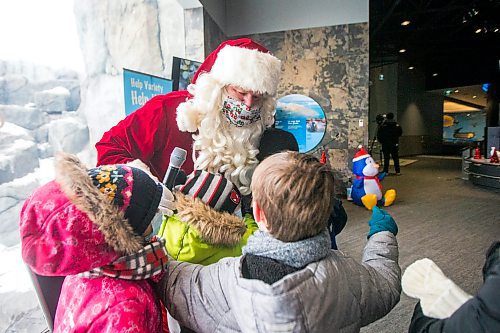 MIKAELA MACKENZIE / WINNIPEG FREE PRESS

Santa visits kids from Lavallee School at a Winter Wonderland party organized by Variety for kids from low-income schools at the Assiniboine Park Zoo in Winnipeg on Monday, Nov. 22, 2021. For Doug Speirs story.
Winnipeg Free Press 2021.