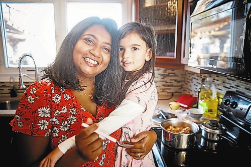 MIKE DEAL / WINNIPEG FREE PRESS

Anucyia Victor Kitching lets her daughter, Faith, 5, taste test her mother&#x2019;s chicken stew at their home in Portage la Prairie, Tuesday morning.

See Anucyia's story

211123 - Tuesday, November 23, 2021.