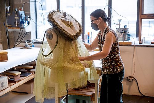 MIKE DEAL / WINNIPEG FREE PRESS
Head of Wardrobe, Thora Lamont works on part of the Queens gown in the wardrobe department.
A behind-the-scene look at the Royal Manitoba Theatre Company's production of Orlando a play by Virginia Woolf and adapted by Sarah Ruhl, which is running from November 25 - December 18.
See Alan Small story
211119 - Friday, November 19, 2021.