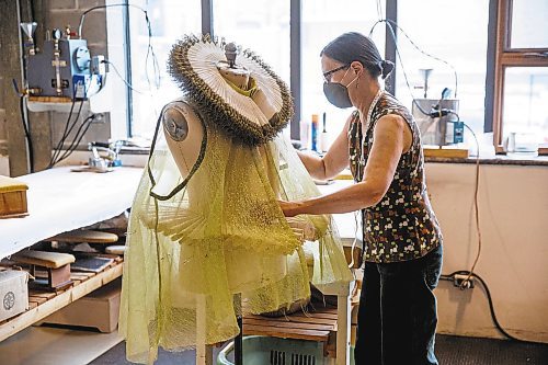 MIKE DEAL / WINNIPEG FREE PRESS
Head of Wardrobe, Thora Lamont works on part of the Queens gown in the wardrobe department.
A behind-the-scene look at the Royal Manitoba Theatre Company's production of Orlando a play by Virginia Woolf and adapted by Sarah Ruhl, which is running from November 25 - December 18.
See Alan Small story
211119 - Friday, November 19, 2021.