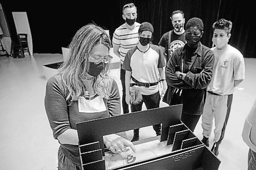 MIKE DEAL / WINNIPEG FREE PRESS

Director, Kelly Thornton holds a miniature version of the stage and tries to describe how the movement of the 24-foot revolve will affect how the actors move about on stage, during rehearsal at MTC Thursday morning. The actors (from left) Simon Bracken, Em Siobhan McCourt, Simon Miron, Ivy Charles and Breton Lalama.

A behind-the-scene look at the Royal Manitoba Theatre Company's production of Orlando a play by Virginia Woolf and adapted by Sarah Ruhl, which is running from November 25 - December 18.

See Alan Small story

211028 - Thursday, October 28, 2021.