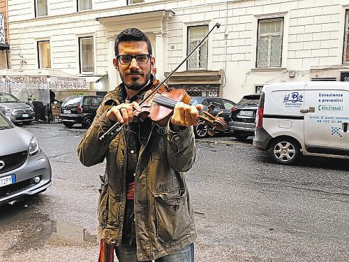 John Longhurst / Winnipeg Free Press

Fiddler Alex Kusturok led the M&#x17d;tis delegation out of the Vatican on March 28.

See Longhurst story