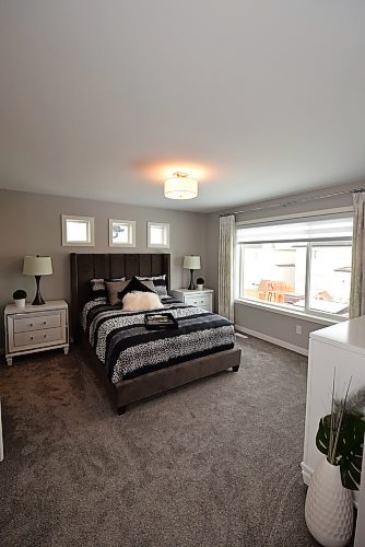 Todd Lewys / Winnipeg Free Press
Generous in size yet warm and comfy, the naturally bright primary bedroom was designed to offer parents a respite from the rigours of long, activity-filled days.