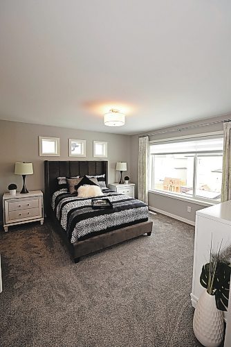 Todd Lewys / Winnipeg Free Press
Generous in size yet warm and comfy, the naturally bright primary bedroom was designed to offer parents a respite from the rigours of long, activity-filled days.