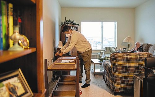 JESSICA LEE / WINNIPEG FREE PRESS



Raini Bowers builds furniture for his client Terrence Mills on December 14, 2021 in Mills&#x2019; residence. During the pandemic, Bowers turned towards freelance building furniture and now it&#x2019;s a side hustle for him.



Reporter: Gabby