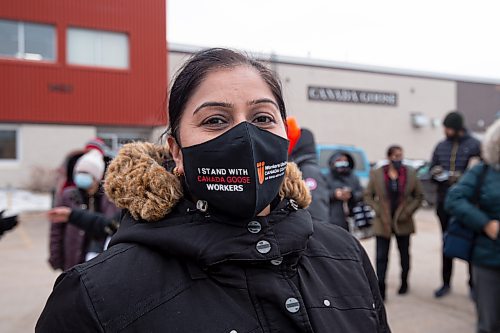 Mike Sudoma / Winnipeg Free Press

Canada goose employee, Kamlesh, Jajuha wears a Workers United mask in the parking lot of Canada goose Thursday

December 2, 2021