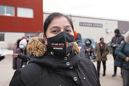 Mike Sudoma / Winnipeg Free Press

Canada goose employee, Kamlesh, Jajuha wears a Workers United mask in the parking lot of Canada goose Thursday

December 2, 2021