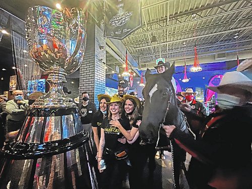 MELISSA MARTIN / WINNIPEG FREE PRESS



Hamilton - December 9, 2021.



Fans gather to take photos with the horse at the Calgary Grey Cup Committee party in Hamilton on Thursday evening.