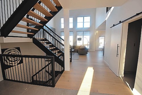 Todd Lewys / Winnipeg Free Press
An open-riser staircase greets you the moment you step into the wide, tiled foyer, which is flanked by a mudroom to the right and powder room to the left.