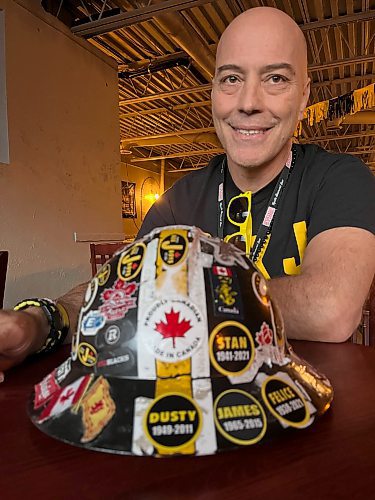 Melissa Martin / Winnipeg Free Press
Jason Allan, one of Hamiltonճ famed Box J Boys, sits with his Box J work hat Ѡadorned with stickers, including memorial ones for Box J boys passed Ѡat the Corktown Pub on Friday afternoon.