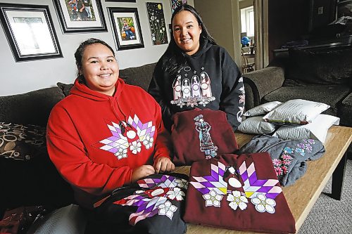 JOHN WOODS / WINNIPEG FREE PRESS

Ariel Spence, left, and her mother Crissy Slater, owners of Red Road Clothing pack some of their clothing orders in their home Tuesday, October 8, 2018. The couple started the indigenous themed clothing line consisting of sweatshirts, t-shirts, skirts and blankets in their home to help fund Ariel's school trip to Italy. They expect to gross $300,000 in sales this year.