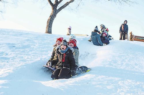 RUTH BONNEVILLE / WINNIPEG FREE PRESS

Local - Sliding Standup

Nathaniel Freeman (front), celebrates his 10th birthday sliding with friends and family members at Omands Creek hill Saturday. 

Dec 18th,  2021