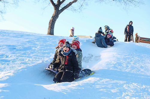 RUTH BONNEVILLE / WINNIPEG FREE PRESS

Local - Sliding Standup

Nathaniel Freeman (front), celebrates his 10th birthday sliding with friends and family members at Omands Creek hill Saturday. 

Dec 18th,  2021