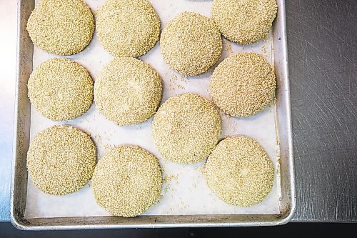 MIKAELA MACKENZIE / WINNIPEG FREE PRESS

Carter Bouchard, owner of Salt and Sunshine Bagels (a specialty bagel bakery she started on Instagram during the pandemic), whips up a batch of sesame bagels in her rented kitchen space at the Irish Association in Winnipeg on Thursday, May 20, 2021.  For Eva Wasney story.
Winnipeg Free Press 2020.