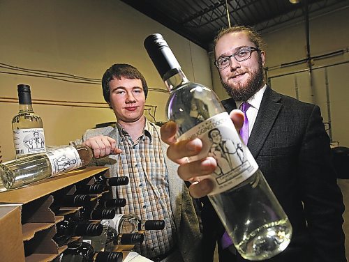 PHIL HOSSACK / WINNIPEG FREE PRESS -  Zach Isaacs (left) and his partner Willows Christopher are a couple of 20 year-olds who have started a home-made wine delivery company &#x2013; selling high octane wine ($9.99) with home delivey. See Martin Cash story.  (the wine is clear because it's made without fruit (grapes) just a sugar solution and &quot;special&quot; yeast that p[roduces 20% alcohol content.)  ....January 23, 2017