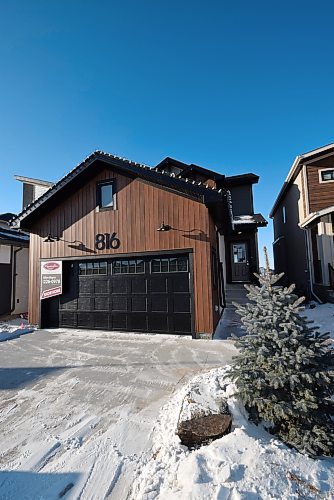 Photos by Todd Lewys / Winnipeg Free Press 
An exterior clad with warm siding provides a fitting prelude to the home's inviting and highly functional interior.