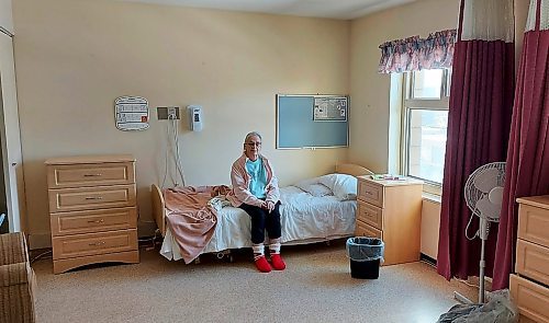 JOHN DOBBIN PHOTO



John Dobbin's mother sits in her new residence at Beacon Hill Lodge shortly after arriving in January 2021.

- for Kevin Rollason story / Winnipeg Free Press
