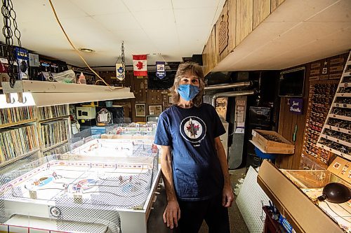 Mike Sudoma / Winnipeg Free Press
Collector Cal Swerid, and his collection of hockey tables Thursday morning in the basement of his home.
December 16, 2021