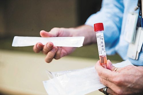 MIKAELA MACKENZIE / WINNIPEG FREE PRESS



Dr. Paul Van Caeseele, assistant director of Cadham Provincial Laboratory, holds a swab and transport agent in front of the lab in Winnipeg on Thursday, April 16, 2020. For Dylan Robertson story.

Winnipeg Free Press 2020