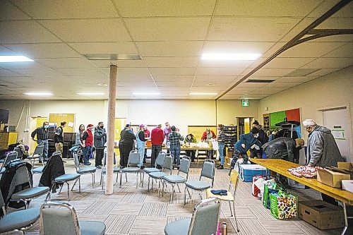 MIKAELA MACKENZIE / WINNIPEG FREE PRESS

Volunteers at the Mission Baptist Church pack up hot Christmas meals in Winnipeg on Saturday, Dec. 25, 2021.  For Malak story.
Winnipeg Free Press 2021.