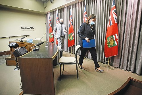 JOHN WOODS / WINNIPEG FREE PRESS
Dr. Brent Roussin, Manitoba chief public health officer, and premier Heather Stefanson leave the province's latest COVID-19 update at the Manitoba legislature in Winnipeg Monday, December 27, 2021.  

Re: ?