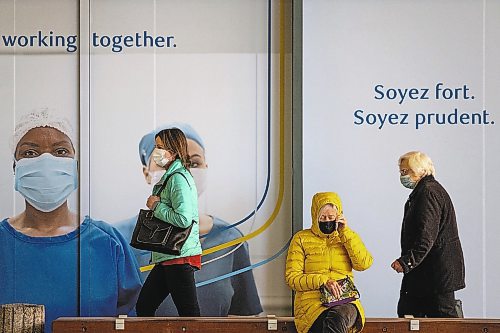 Daniel Crump / Winnipeg Free Press. People come and go from the RBC Convention Centre downtown as they get their COVID-19 vaccinations Wednesday afternoon. March 31, 2021.