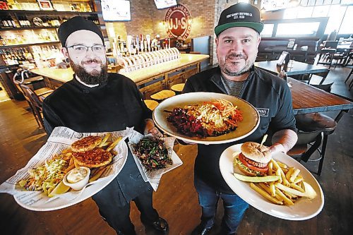 JOHN WOODS / WINNIPEG FREE PRESS
Dennis Burnett, kitchen manager, left, and Jay Kilgour, owner and GM, show off some of the many plant based meat-like products on the menu at Fionn MacCool&#x2019;s Crossroad and Grant Park restaurants in Winnipeg Thursday, January 30, 2020. 

Reporter: Scott-Reid