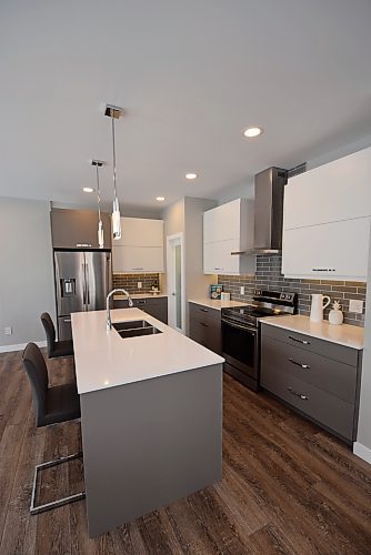 Todd Lewys / Winnipeg Free Press

The roomy island kitchen in this Prairie Pointe home is clean and stylish. 